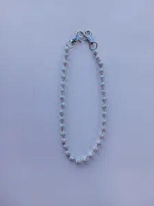 Sparkly rhinestone disco ball chain, detailed view of shimmering beads and metal clasps for DIY.
