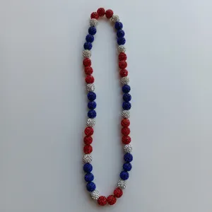 Detailed macro shot of red white blue rhinestone shamballa bead necklace with brilliant crystals.