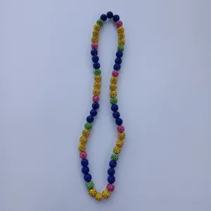 Detailed shot of colorful crystal rhinestone disco ball beads elastic necklace, shiny jewelry.