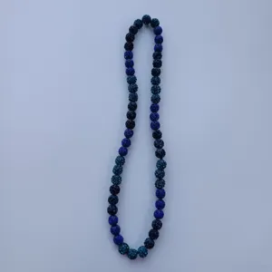 Detailed close-up view of the sparkling blue rhinestone clay bead necklace details.