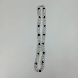 Shamballa rhinestone and black bead necklace detail view, elegant sparkly jewelry item.