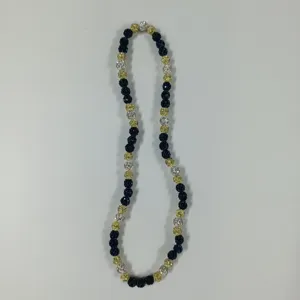 Detailed view of colorful rhinestone shamballa necklace with blue, gold and silver crystal beads.