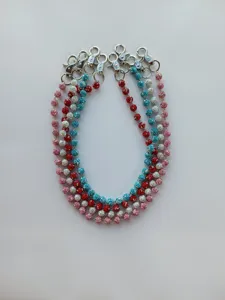 Detailed view of 12mm sparkly disco ball chains in red, blue, pink and silver