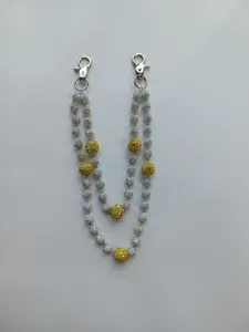 Detail of 12mm silver and yellow rhinestone ball hip-hop pants chain with lobster clasps