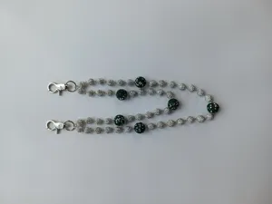 Detail view of 12mm rhinestone disco ball bead pant chain featuring silver lobster clasps