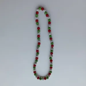 Detailed view of a Christmas style red green silver crystal ball beaded shamballa necklace.