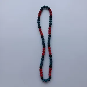 Detailed close-up of colorful rhinestone clay beads strand, sparkling DIY jewelry accessory.