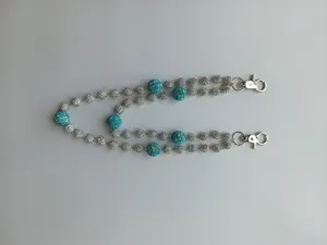 Detail view of 12mm teal and silver rhinestone shamballa bead pants chain for hip-hop style