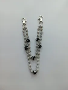 Detail of 12mm silver and black clay pave rhinestone beads on a stylish hip-hop chain.
