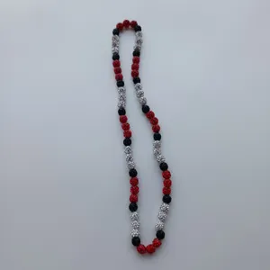 Sparkling rhinestone clay bead necklace detail featuring red, black and silver crystal balls.