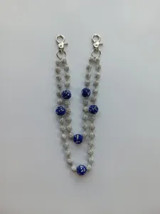 Detailed view of 12mm sparkling blue and silver rhinestone bead pants chain accessory.