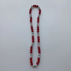 Red and silver Shamballa rhinestone clay bead necklace detail, elastic beaded fashion accessory.