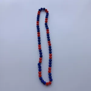 Detail view of red and blue sparkling rhinestone disco ball beads necklace strand.