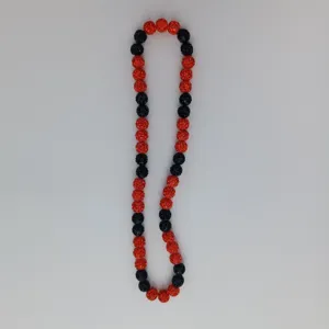 Red and black rhinestone disco ball bead necklace detail shot, sparkling clay crystal jewelry.