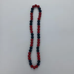 Close-up detail of the sparkling red and blue rhinestone shamballa beaded necklace style.