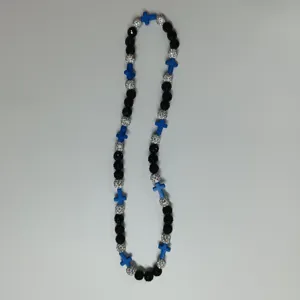Fashion beaded necklace with black beads, silver rhinestone balls and blue cross pendants.
