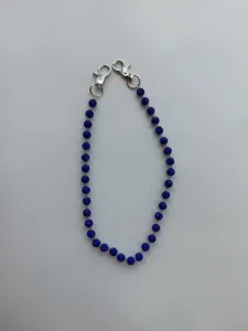 Blue rhinestone pave crystal bead chain with silver metal lobster clasps for bag and pants.
