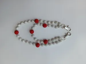 Detailed view of the 12mm red and white rhinestone bead double layer pants chain with metal clasps