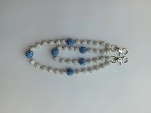 Detail view of 12mm blue and white crystal bead hip hop pant chain with lobster clasp.