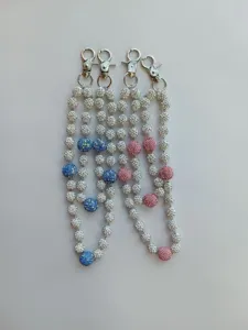 Close-up of 12mm rhinestone pavé bead chains in pink, blue and white finishes