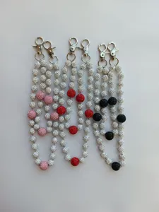 Detailed view of 12mm rhinestone shamballa bead chains in pink, red, and black.