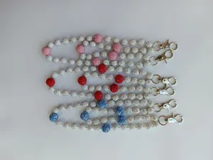 Detailed view of 12mm rhinestone clay bead chains with silver metal clips for bag charms