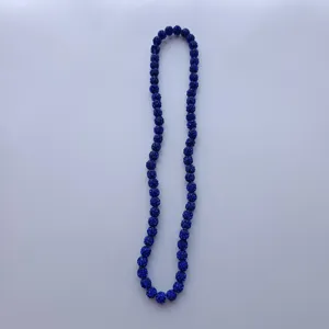 Detailed close-up view of dark blue Shamballa rhinestone bead necklace string display