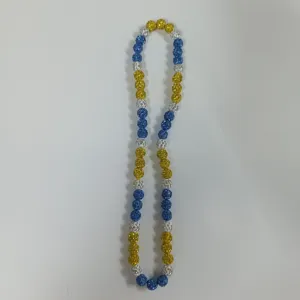 Detailed close-up view of a colorful rhinestone beaded necklace, showing sparkling bead textures.