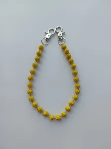 Detail shot of 12mm yellow rhinestone clay bead hip-hop waist chain with silver clasps