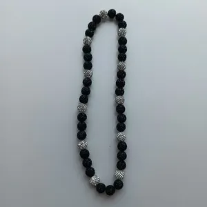 Black and silver crystal clay bead necklace detail showing sparkly shamballa rhinestones.