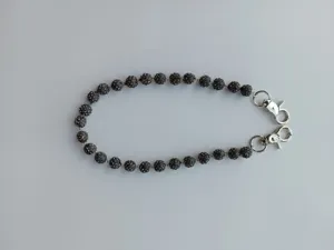 Macro view showing 12mm sparkling clay rhinestone beads on a stylish hip hop pant chain