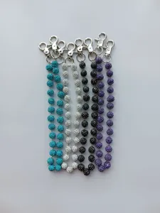 Detailed view of 12mm rhinestone clay ball trouser chains in multiple colors with silver clasps.