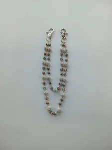 Detailed view of 12mm colorful rhinestone and clay bead pants chain with dual silver clasps