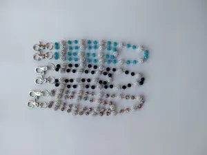 Close-up of 12mm rhinestone disco ball hip-hop pants chains with metal lobster clasps