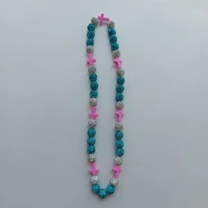 Colorful beaded necklace with blue silver disco balls and pink cross charms for women fashion.