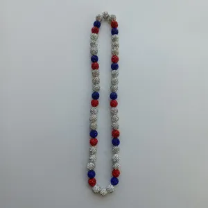 Detail view of the colorful rhinestone shamballa bead necklace with red white and blue stones.