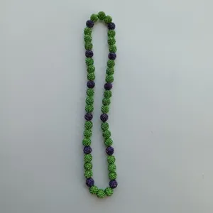 Green and purple rhinestone Shamballa bead necklace detail view, vibrant sparkling sphere design.