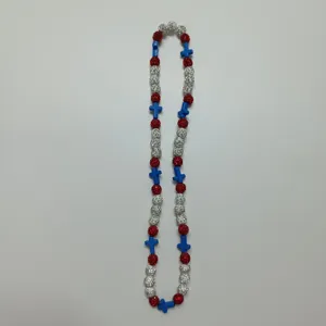 Colorful beaded necklace featuring red silver rhinestone balls and blue cross charms for styling.