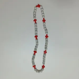 Detailed view of the rhinestone shamballa balls and red cross beads necklace for hip hop style.
