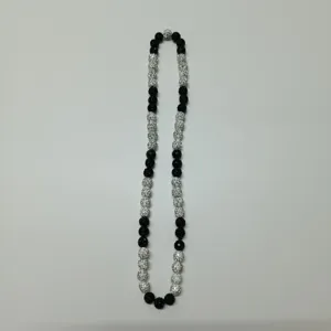 Detailed view of black and white rhinestone shamballa beaded necklace with elastic design.