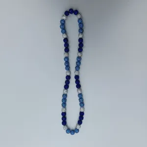 Detailed close-up view of blue and silver rhinestone disco ball clay beads necklace.