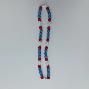 Red and blue rhinestone clay bead necklace detail view with white cross pendants, colorful chic styling.