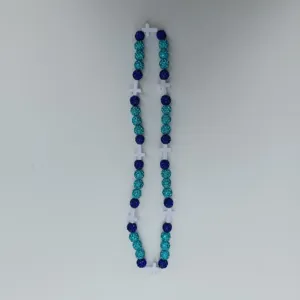 Blue and turquoise rhinestone disco ball beads necklace with white cross details view