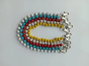 Detailed view of colorful rhinestone Shamballa bead chains with sturdy metal lobster clasps.