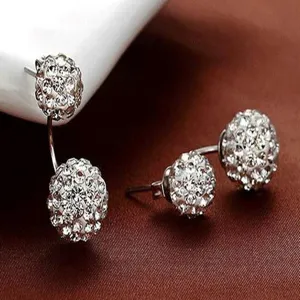Close-up of elegant silver plated double white crystal ball Shamballa earrings