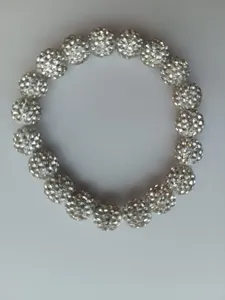 Detailed close-up of sparkling rhinestone paved spherical beads bracelet showing exquisite craftsmanship.