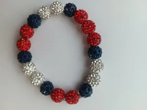 Detailed close-up of a 10mm red, white, and blue rhinestone Shamballa elastic bracelet.