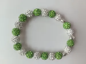 Shamballa style crystal beaded bracelet with green and white pave rhinestone round balls.