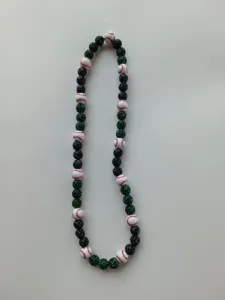 Baseball themed Shambhala necklace featuring green and black rhinestone beads on white.