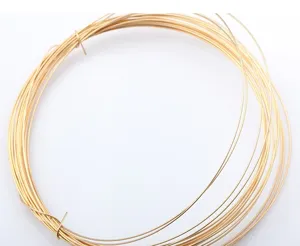 Detailed macro view of 14k gold-filled jewelry wire coil for DIY beading and crafts